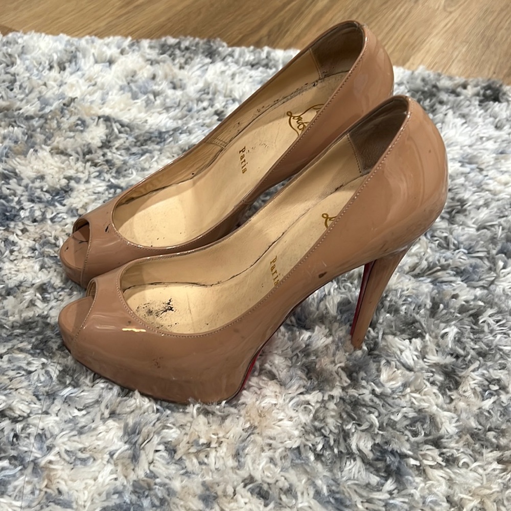 Nude red bottoms. Worn.